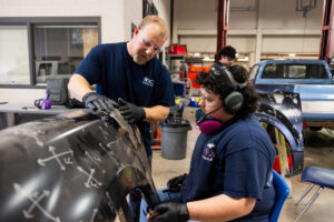 A student sanding car parts during class at Crockett high school (ACC South Austin campus.)