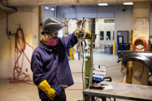 Welding auto parts during class at Crockett high school (ACC South Austin campus.)