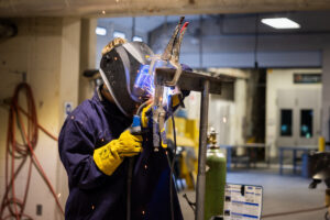 Welding auto parts during class at Crockett high school (ACC South Austin campus.)