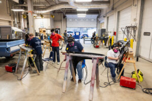 Students working on car parts during class at Crockett high school (ACC South Austin campus.)